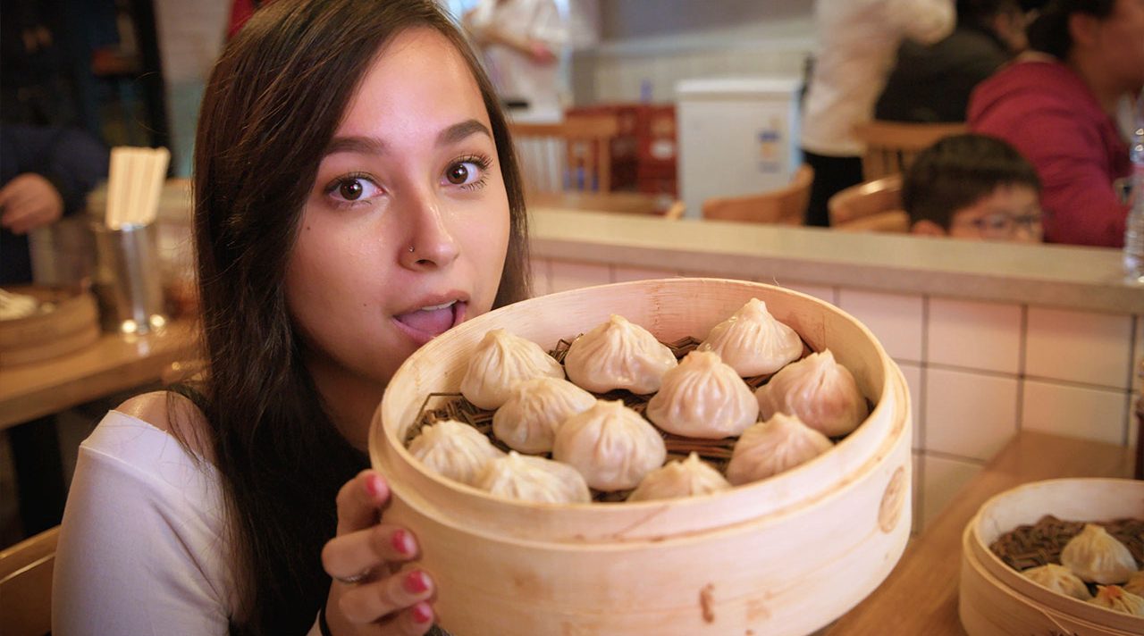 J Lou holding Xiao Long Bao | Shanghai Snacks Part 1 | The China Travel Video | ANYDOKO